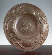 John Pearson. A Newlyn Arts & Crafts copper charger, the centre embossed with a galleon, the