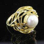 An 18ct gold, mabe pearl and diamond set free form dress ring, indistinctly signed, size Q.