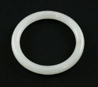 A Chinese white jadeite bangle, of good even tone, 9cm.