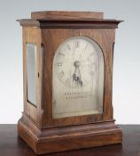 A Victorian rosewood mantel timepiece, in plain architectural case, with arched silvered dial signed