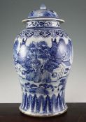 A large Chinese blue and white baluster jar and cover, 19th century, painted with figures near