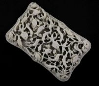 An unusual Chinese export ivory card case, 19th century, the front carved in high relief with sea