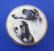 An early 20th century continental silver and guilloche enamel circular pill box painted with two