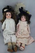 An Armand Marseille bisque headed doll, 370, with impressed marks AM and 3 DEP, with soft body and