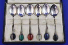 A cased set of six George V silver coffee spoons by Liberty & Co, the terminals set with semi