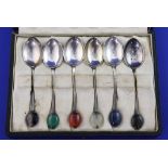 A cased set of six George V silver coffee spoons by Liberty & Co, the terminals set with semi