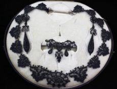 A 19th century Berlin? ironwork parure, comprising a necklace, brooch and pair of drop earrings,