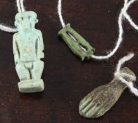 Three Egyptian turquoise glazed faience amulets, modelled as Imsety leaning against the Emblem of