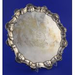 An early George III silver salver by Ebenezer Coker, of shaped circular form, with shell scroll