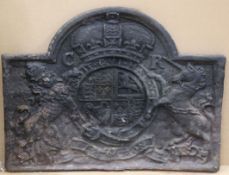 A 17th century cast iron fire back, decorated with the Royal coat of arms, W.3ft 6in. H.2ft 8.5in.
