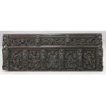 A 17th century Flemish carved oak coffer front, with various panels and figural carvings,