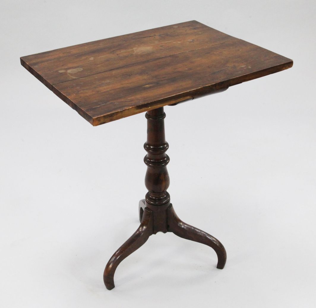 A George III yew wood wine table, with rectangular top, on baluster turned column and three
