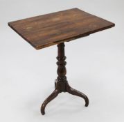 A George III yew wood wine table, with rectangular top, on baluster turned column and three