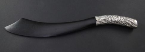 A Victorian ebony page turner, with flat curved blade and embossed silver handle, hallmarks for