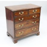 A George III mahogany chest, of two short and three long graduated drawers, on bracket feet, W.2ft