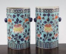 A pair of Chinese enamelled porcelain wall pockets, Qianlong period, painted in imitation of