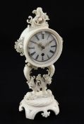 A 19th century French carved ivory boudoir timepiece, the circular dial with Roman numerals, the