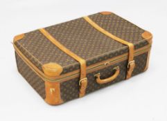 A Louis Vuitton brown leather bound suitcase, 31.5in.