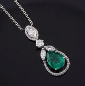 A white gold, emerald and diamond drop pendant necklace, set with marquise and round cut diamonds