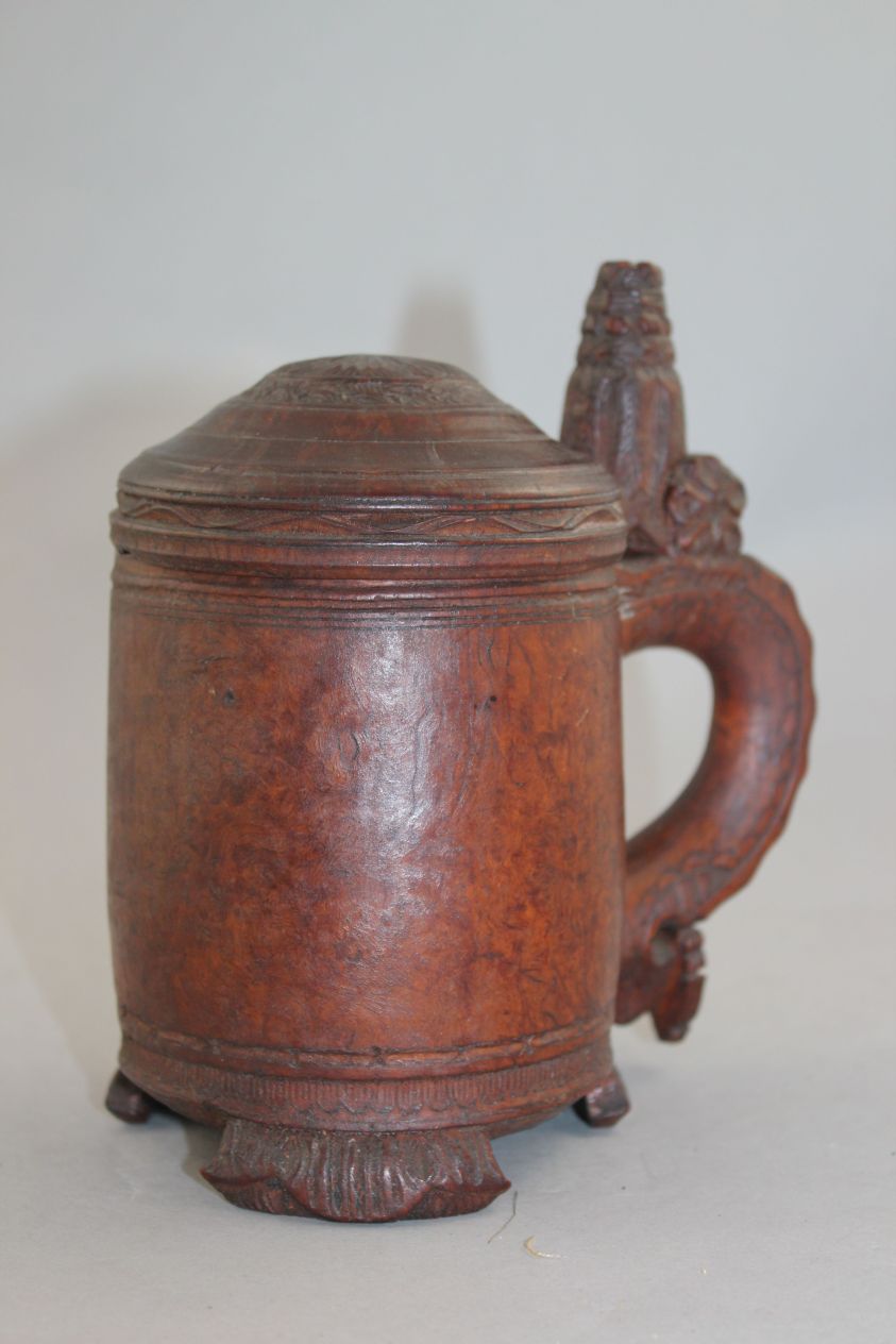 A 19th century Norwegian birch wood peg tankard, with carved thumb piece and domed lid, with - Image 5 of 5