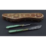 A late 17th / early 18th century folding travelling knife and fork, each with green stained ivory