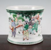 A Chinese famille verte brush pot, of cylindrical waisted form, painted with figures in a