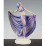 Josef Lorenzl for Goldscheider. An Art Deco figurine of a dancer, wearing a pink and violet head