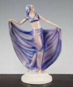 Josef Lorenzl for Goldscheider. An Art Deco figurine of a dancer, wearing a pink and violet head
