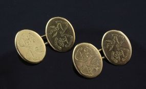 A pair of early 20th century 18ct gold oval cufflinks, each link engraved with two armorials, 14