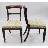 A set of six Regency mahogany dining chairs, with shaped crest rails, overstuffed seats and reeded