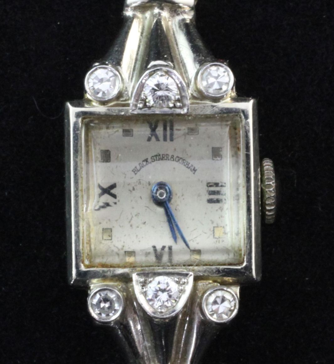 A lady's 1930's Art Deco 14ct white gold cocktail watch, with square Roman and dot marker dial