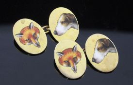 A pair of early 20th century 9ct gold and enamel hunting related 'fox and hound' oval cufflinks,