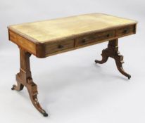 A 19th century mahogany library table, with three frieze drawers opposing three dummy drawers,