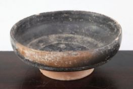 A Greek blackware rouletted bowl, Apulia c 4th century B.C., with impressed design to the