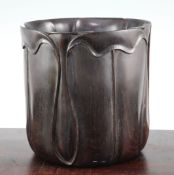 A Chinese rosewood brush pot, possibly Zitan, Qing dynasty, carved as curling lotus petals to the