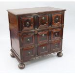 A 17th century and later Dutch oak and fruitwood chest, of three long drawers with geometric