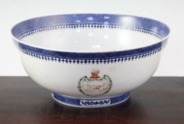 A Chinese export armorial punch bowl, c.1790, painted with a monogrammed shield and the crest of