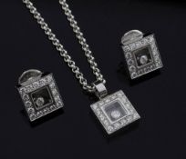 A modern 18ct white gold and diamond suite of jewellery by Chopard, comprising a pendant on chain