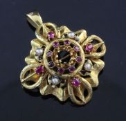 An early 20th century 18ct gold, ruby, split pearl and black enamel pendant brooch, of pierced