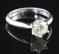 An 18ct white gold and solitaire diamond ring, the round brilliant cut stone approximately estimated