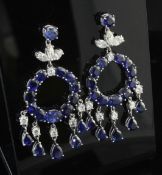 A pair of ornate white gold, sapphire and diamond drop earrings, each of hoop design with five drops