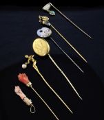 Six assorted 19th/early 20th century stick pins, including French 18ct gold acorn, gold nude lady