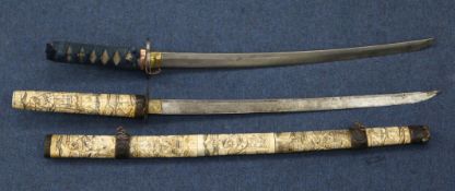 An early 20th century Japanese bone wakizashi, decorated all over with traditional figural scenes,