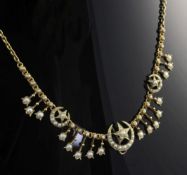 An Edwardian gold and split pearl set fringe necklace, set with flower head, star and crescent