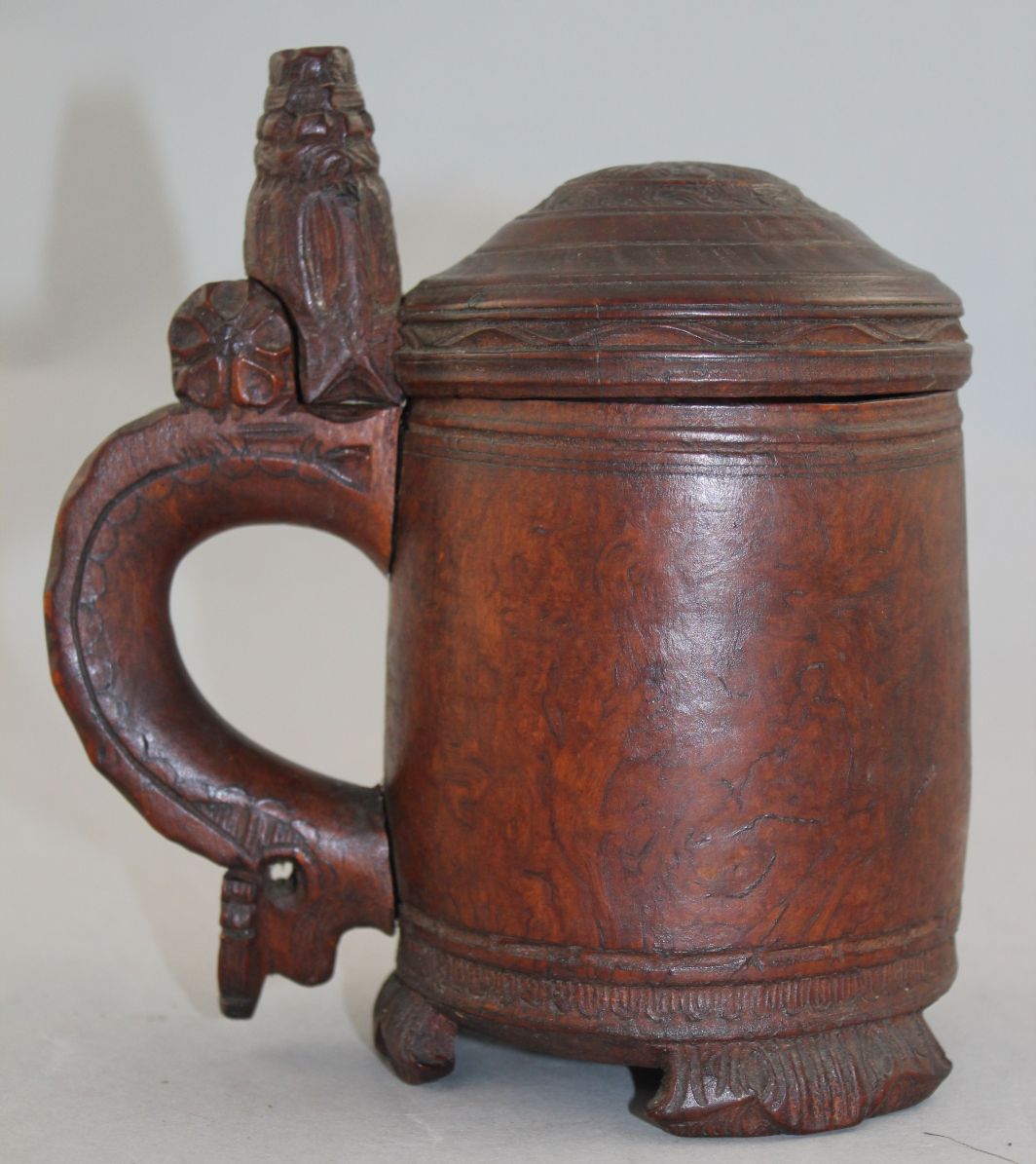 A 19th century Norwegian birch wood peg tankard, with carved thumb piece and domed lid, with - Image 2 of 5