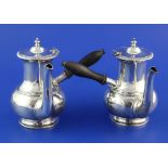 A pair of George V silver cafe au lait pots by William Hutton & Sons Ltd, of baluster form, with