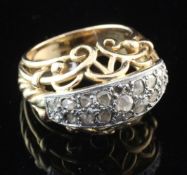 A 1950's/1960's continental gold and rose cut diamond set dress ring, with pierced scroll setting,