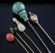 Three assorted late 19th/early 20th century gold stick pins, to include, coral, moonstone and