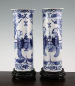 A pair of Chinese blue and white 'Long Eliza' cylindrical vases, late 19th century, each painted