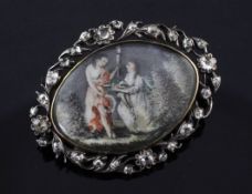 A Georgian silver and gold, diamond set brooch with inset painted ivory panel, decorated with a lady